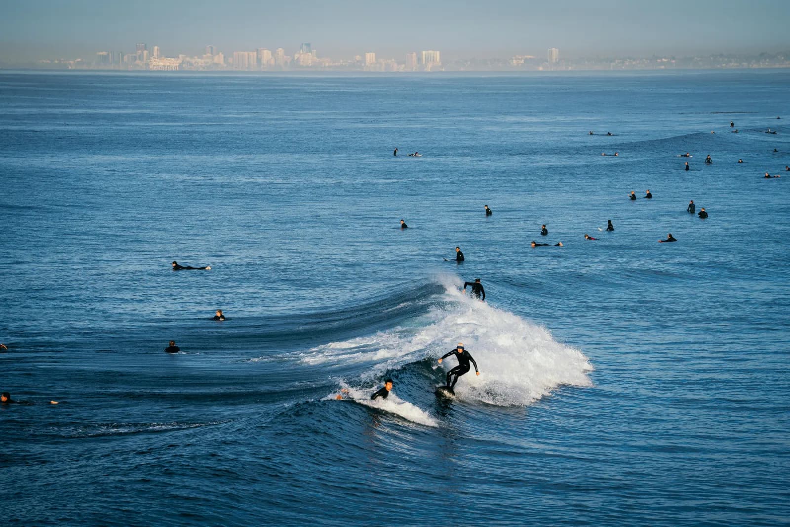 A wide stretch of San Diego coastline showing the variety of breaks, bluffs, and beaches the surf-spot pages cover